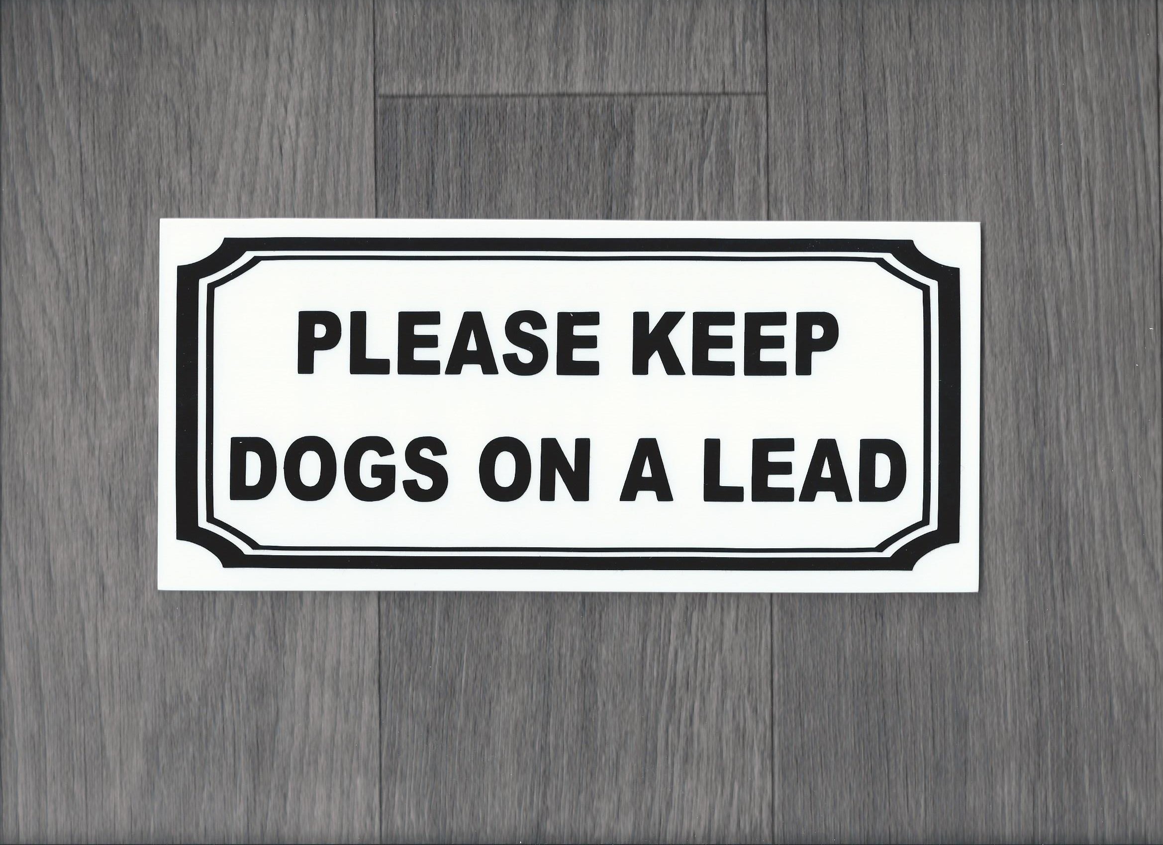 Please keep dogs on a lead. Plastic Indoor / Outdoor Sign. (DS11)